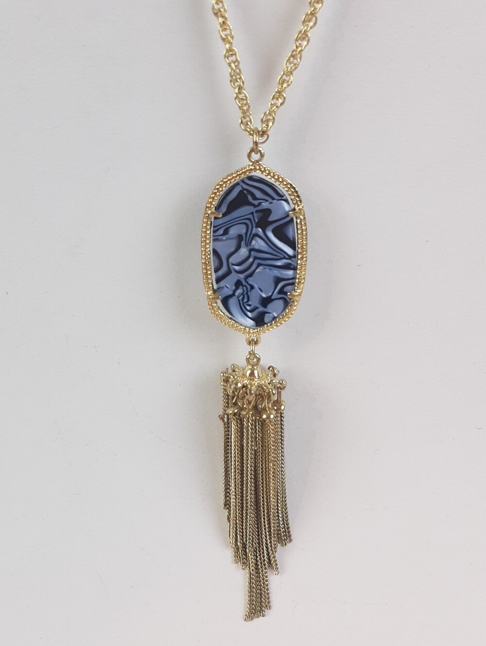 Designer inspired blue oval stone and a long metal tassel fashion necklace
